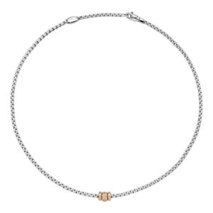 An 18ct white and rose gold Flex'It necklace with three rose gold diamond set rondels, belonging to FOPE's Eka collection.