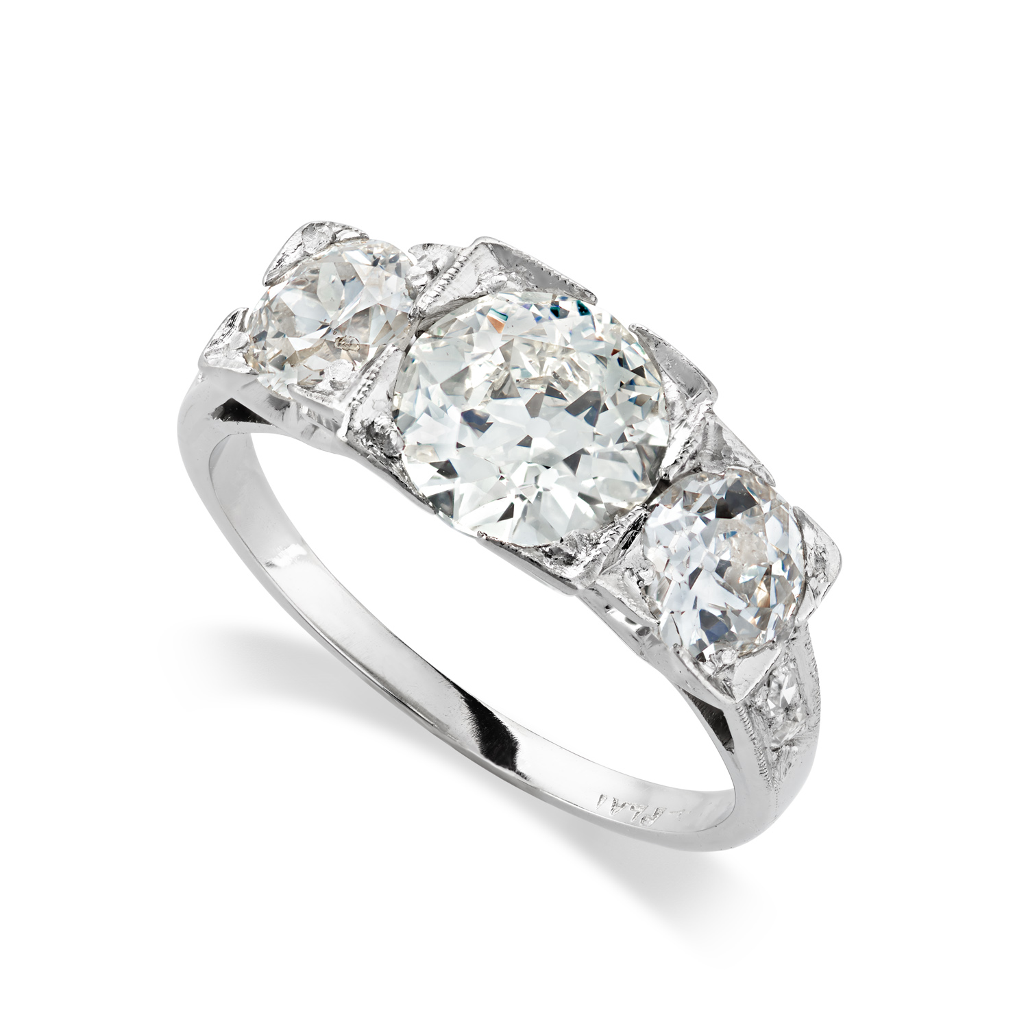 H L Brown Group of Jewellers A platinum old brilliant cut diamond three stone ring.