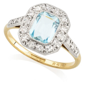 18ct yellow gold and platinum emerald cut aquamarine and diamond octagonal cluster ring.