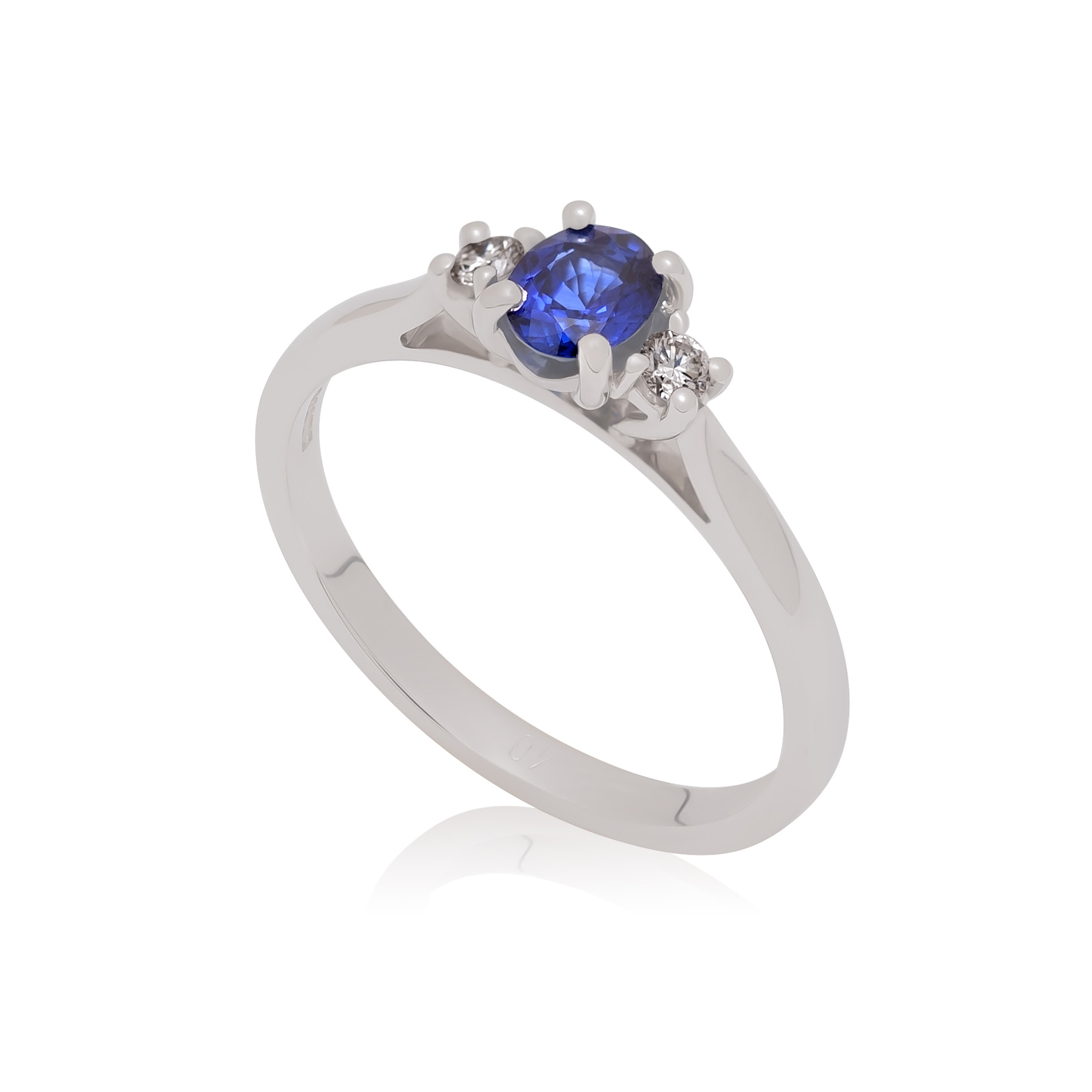 An 18ct white gold oval shaped sapphire and round brilliant cut diamond three stone ring.