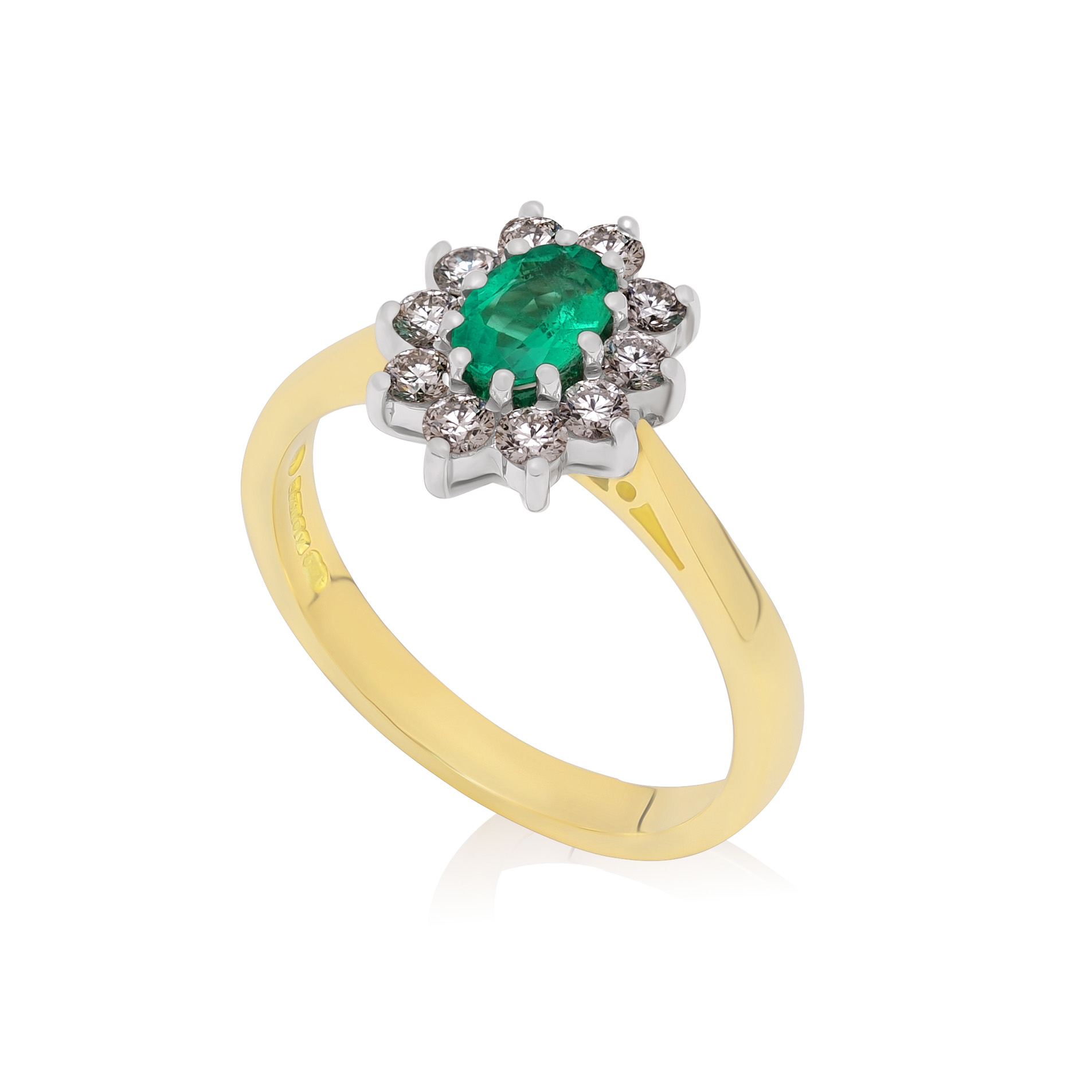 An 18ct yellow and white gold oval shaped emerald and diamond cluster ring, featuring ten brilliant cut diamonds.