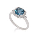 A 9ct white gold blue topaz and diamond set fancy cluster ring.