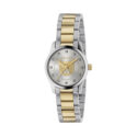 Gucci G-Timeless with a 27mm stainless steel and yellow gold PVD coated case and bracelet strap featuring a diamond set silver dial with a gold tone cat emblem.