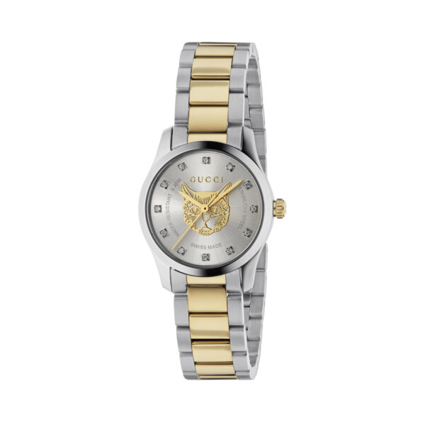 Gucci G-Timeless with a 27mm stainless steel and yellow gold PVD coated case and bracelet strap featuring a diamond set silver dial with a gold tone cat emblem.