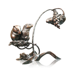 Made from solid foundry bronze, this piece depicts two harvest mice sitting together with a third balancing on the wheat sheaf.