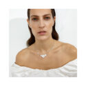 A sterling silver four white enamelled flower necklace from Georg Jensen's Daisy collection.