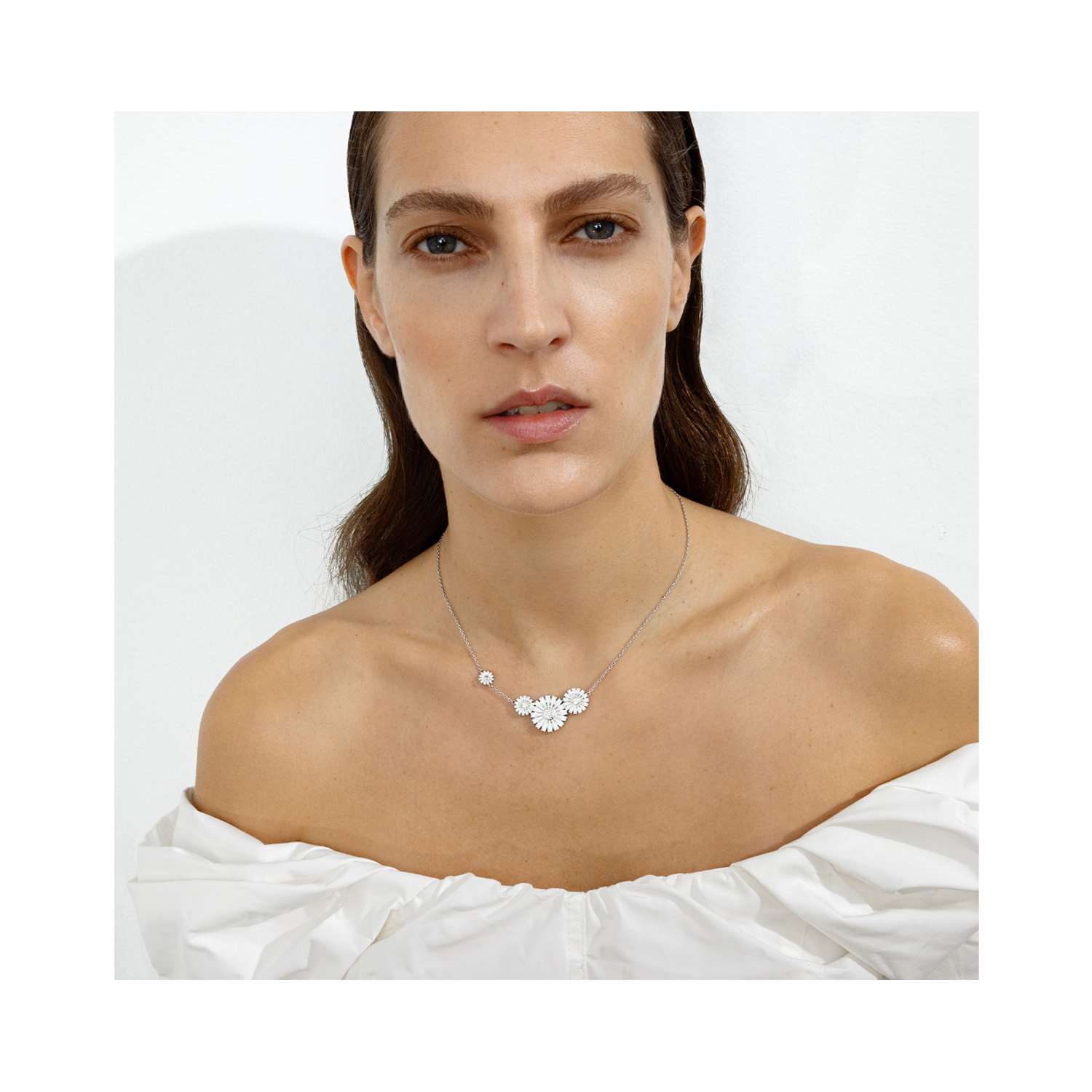 Georg Jensen, Sterling Silver Daisy Four Flower Necklace A sterling silver four white enamelled flower necklace from Georg Jensen's Daisy collection.