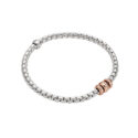 An 18ct white gold Flex’It bracelet with three 18ct rose gold diamond set rondels belonging to the FOPE EKA collection.
