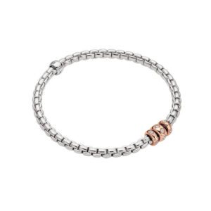 An 18ct white gold Flex'It bracelet with three 18ct rose gold diamond set rondels belonging to FOPE's EKA collection.