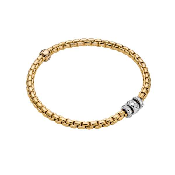 An 18ct yellow gold Flex'It bracelet with three 18ct white gold diamond set rondels belonging to FOPE's EKA collection.