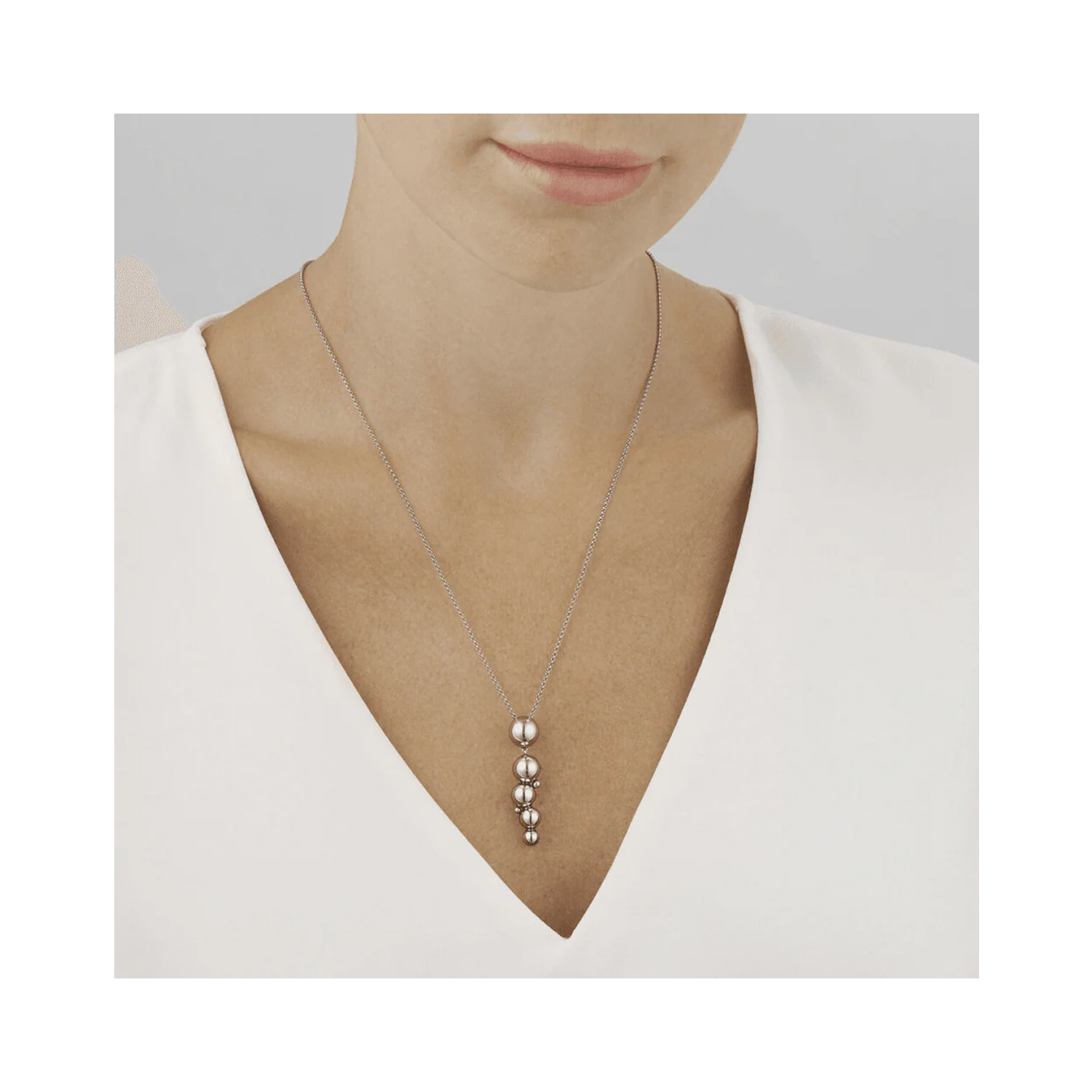 A sterling silver drop pendant and chain from Georg Jensen's Moonlight Grapes collection.