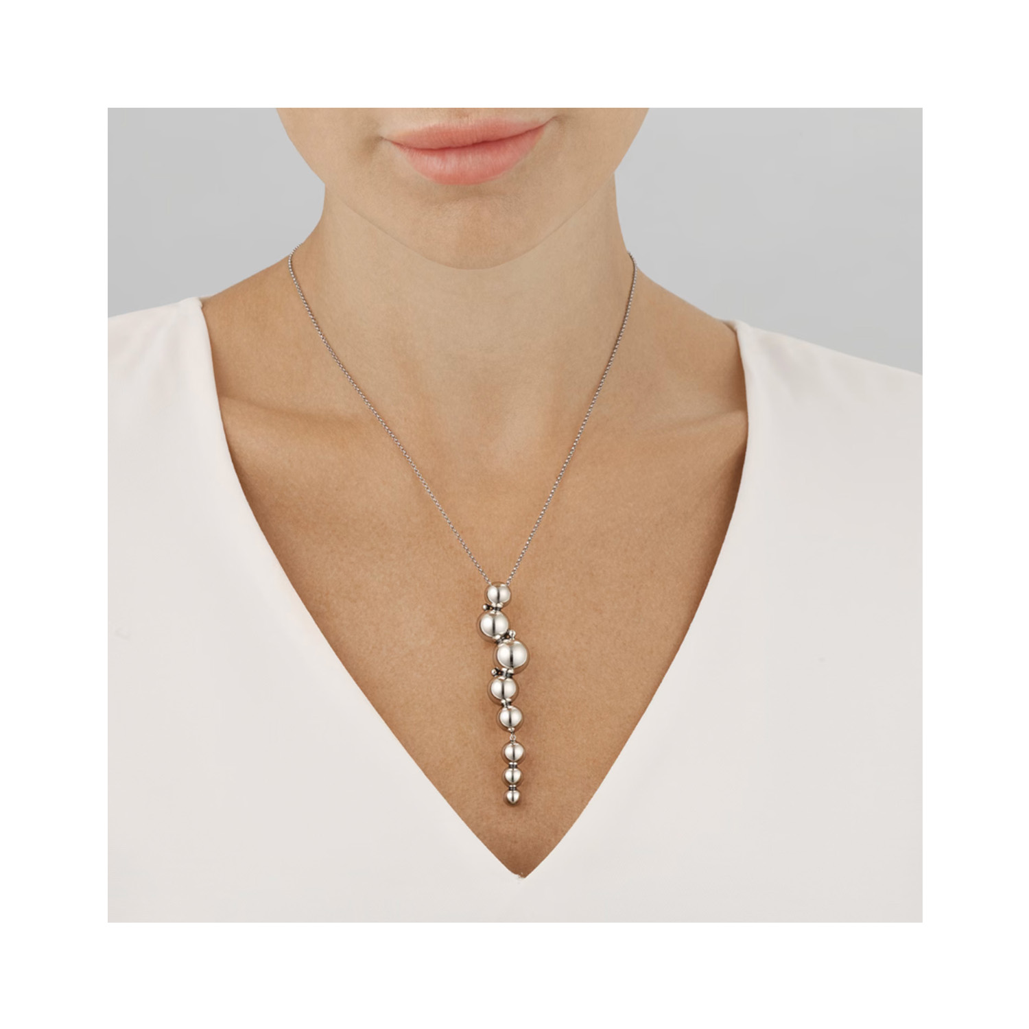 Georg Jensen, Sterling Silver Moonlight Grapes Long Drop Pendant & Chain A sterling silver drop pendant and chain from Georg Jensen's Moonlight Grapes collection.