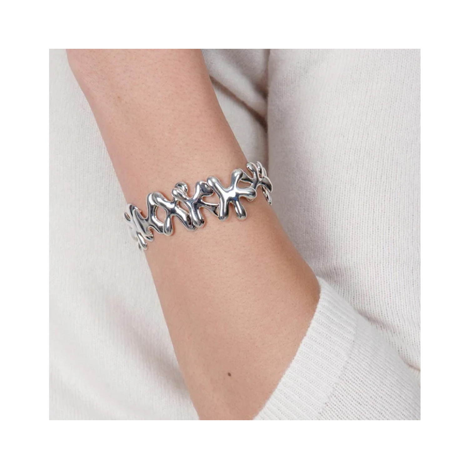 A sterling silver bracelet with small splash shaped links from Lucy Quartermaine's Splash collection.