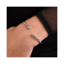 A sterling silver, polished bangle from Lucy Quartermaine's Drop collection.