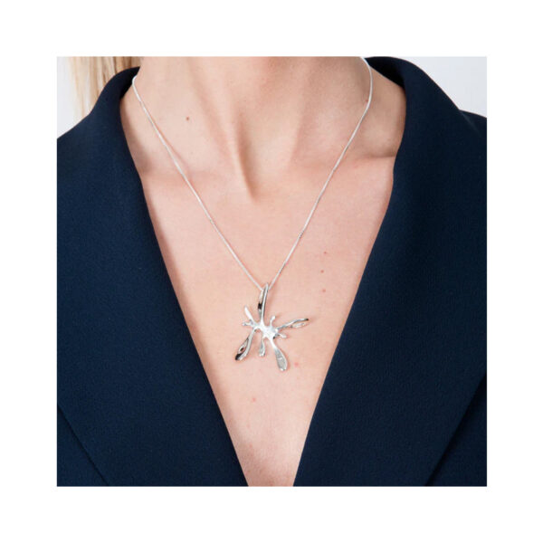 A sterling silver splash pendant on a chain from Lucy Quartermaine's Splash collection.