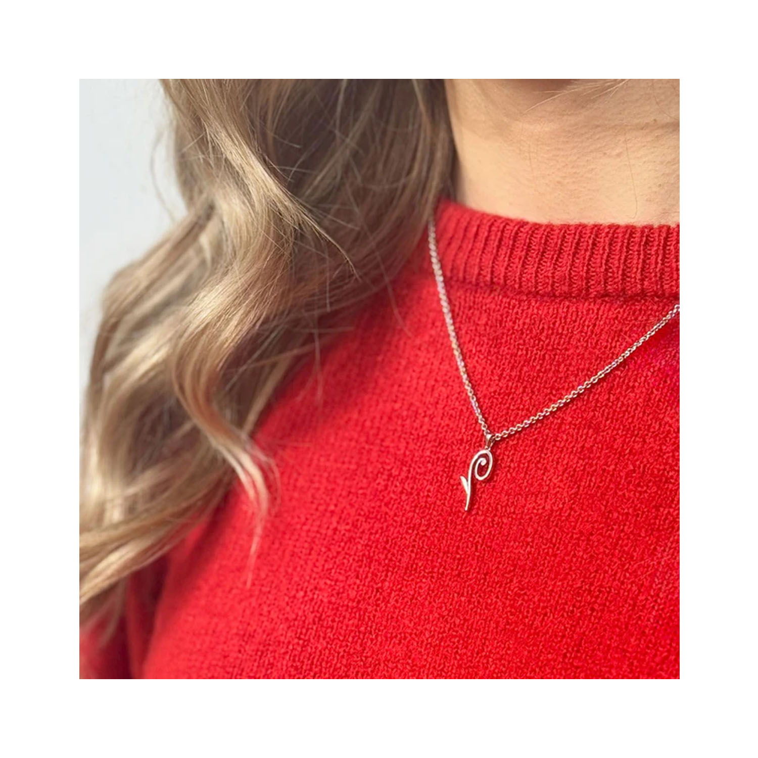A sterling silver 'Q' pendant and chain from Lucy Quartermaine's Q collection.