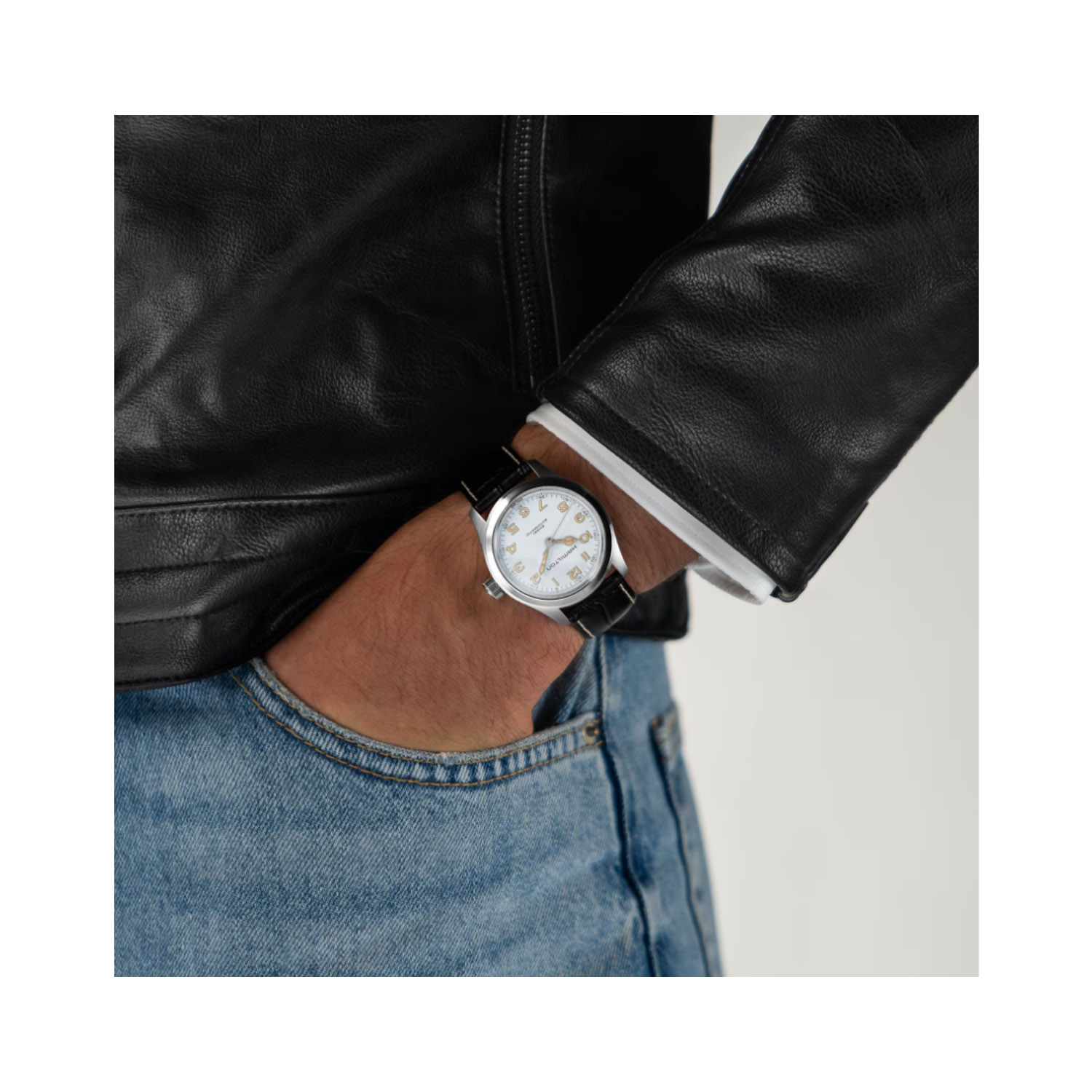 Hamilton, Khaki Field Murph with a 38mm stainless steel case and a black leather strap featuring a white arabic numeral dial.