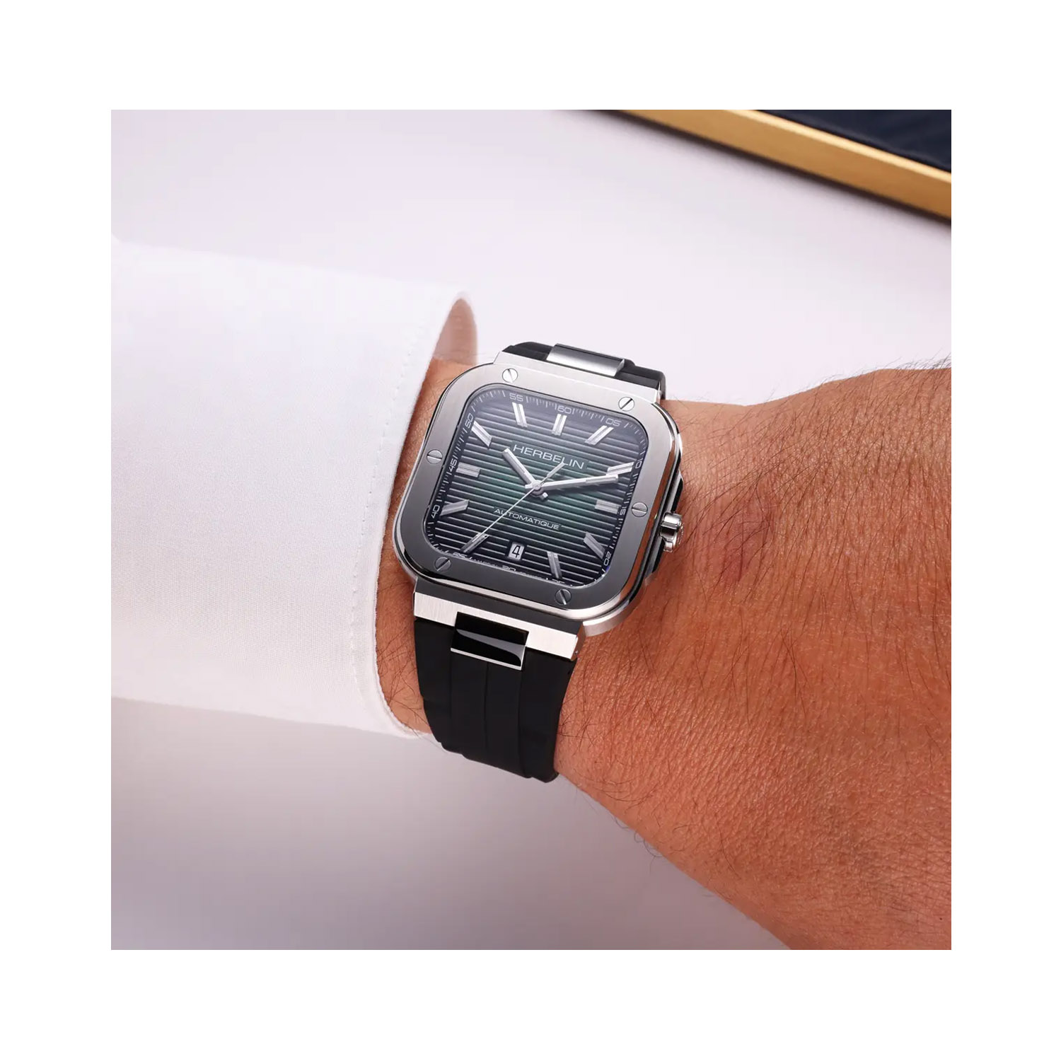 Herbelin, Cap Camarat Square with a 39mm stainless steel case and a black rubber strap featuring a date function with a green dial.