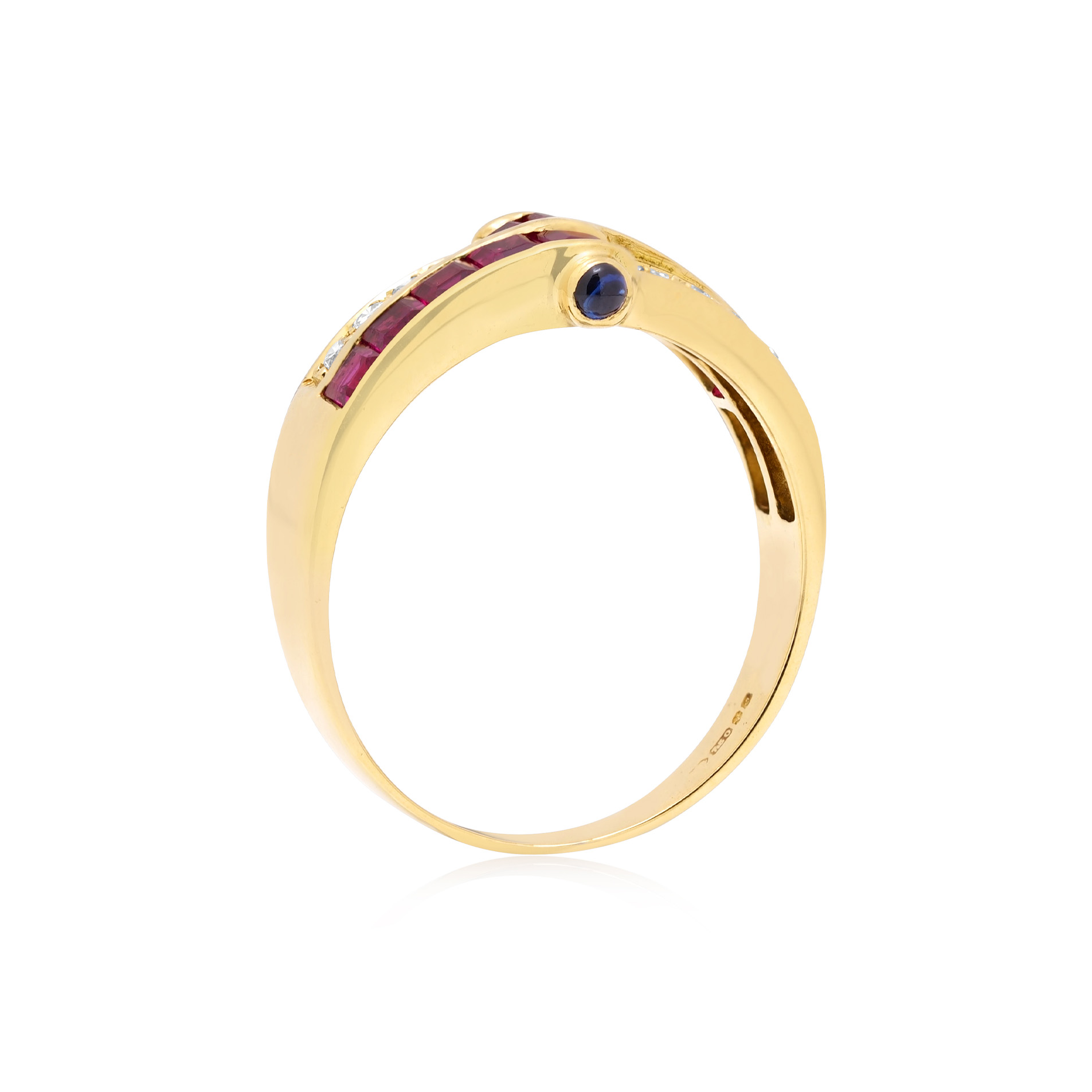 18ct Yellow Gold Ruby & Diamond Ring with Cabochon Sapphires An 18ct yellow gold ring with square cut rubies, round brilliant cut diamonds and cabochon sapphires set to the side.