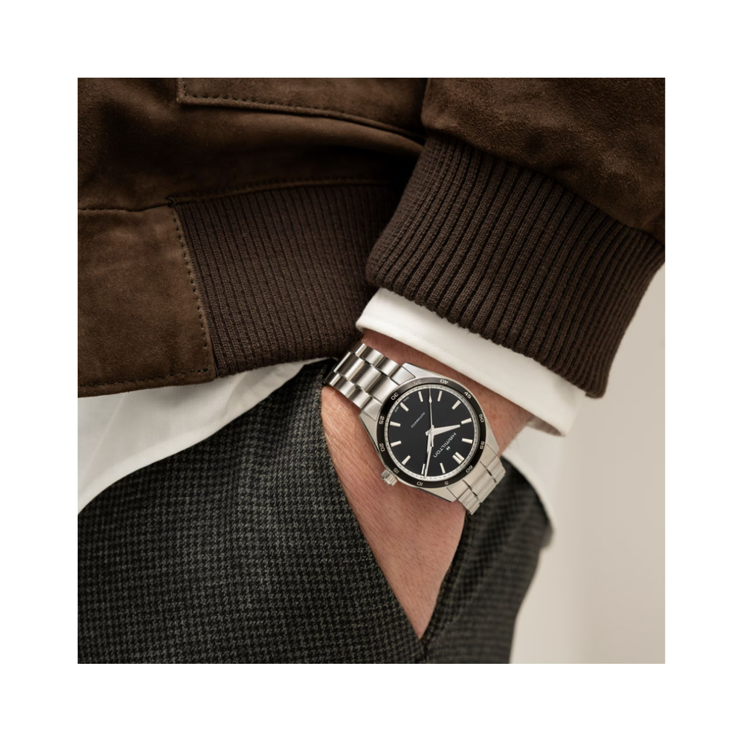 Hamilton, Jazzmaster Performer with a 38mm stainless steel case and bracelet strap featuring a black dial and bezel.