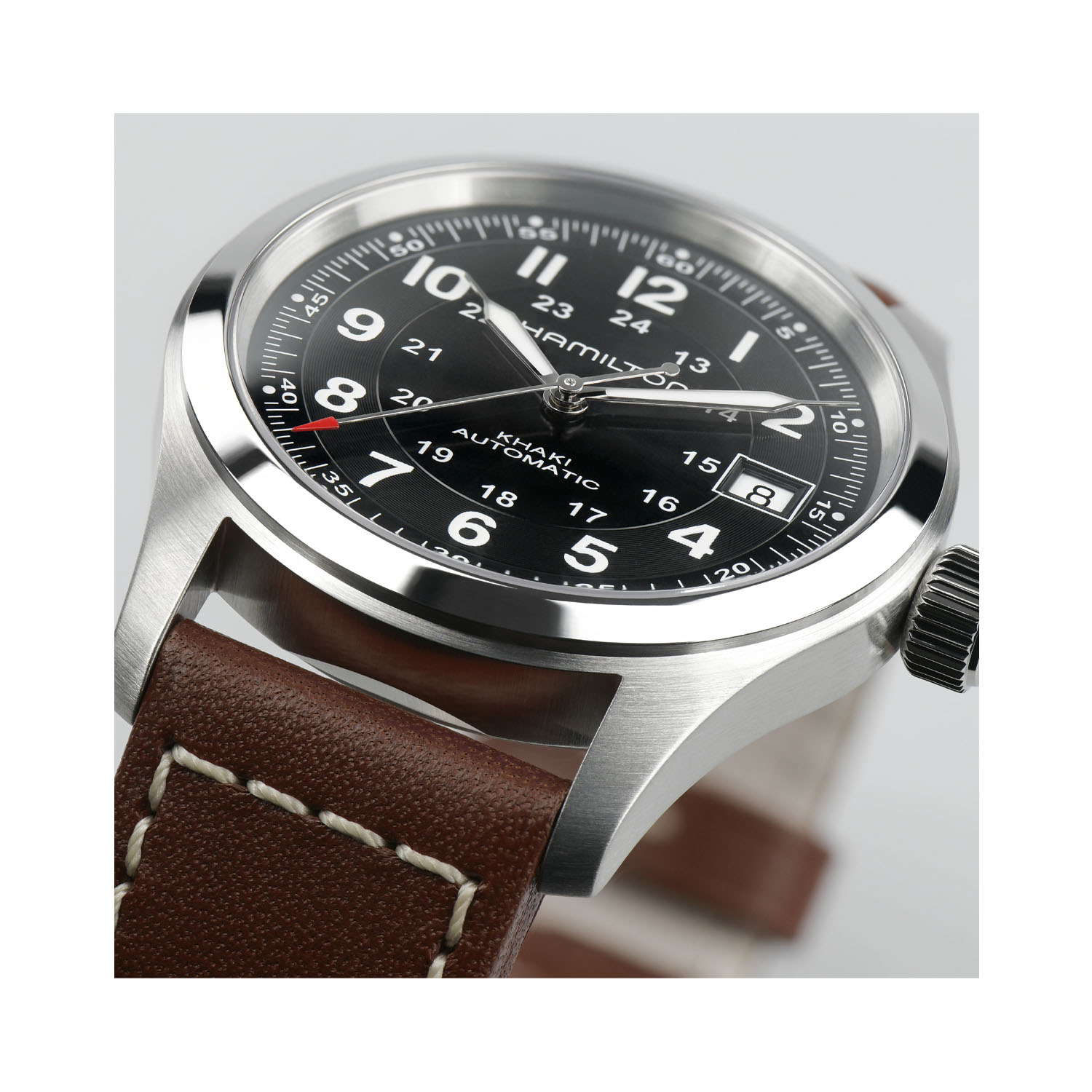 Hamilton, Khaki Field Black Dial, Automatic Men’s 38mm Watch Hamilton, Khaki Field with a 38mm stainless steel case and a brown leather strap featuring a date function and a black dial.