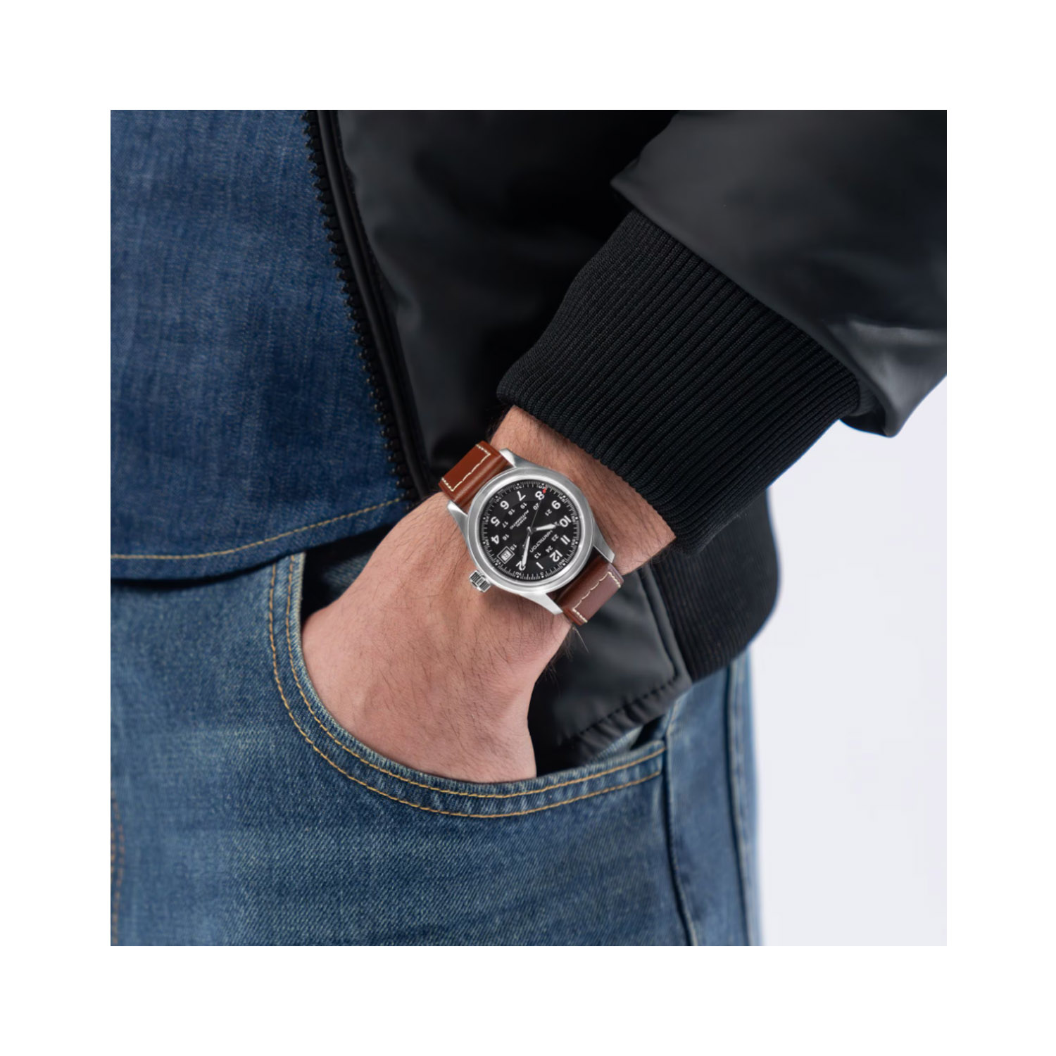 Hamilton, Khaki Field Black Dial, Automatic Men’s 38mm Watch Hamilton, Khaki Field with a 38mm stainless steel case and a brown leather strap featuring a date function and a black dial.