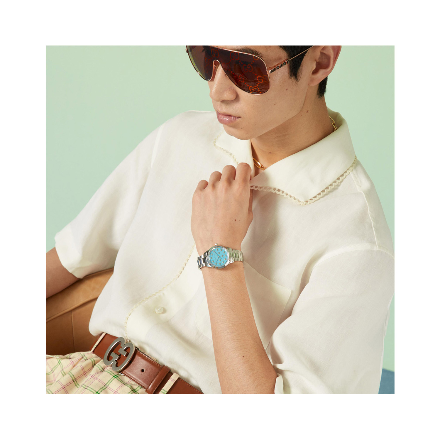 Gucci G-Timeless with a 32mm stainless steel case and bracelet strap featuring a turquoise dial with the bee emblem.