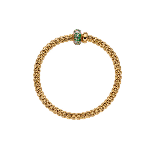 An 18ct yellow gold Flex'It bracelet with an emerald and diamond rondel and a polished diamond set rondel, belonging to FOPE's Solo collection.