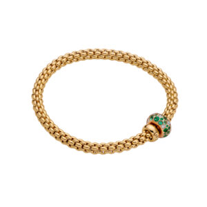 An 18ct yellow gold Flex'It bracelet with an emerald and diamond rondel and a polished diamond set rondel, belonging to FOPE's Solo collection.