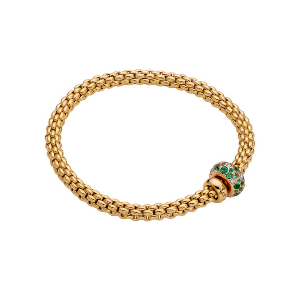 An 18ct yellow gold Flex'It bracelet with an emerald and diamond rondel and a polished diamond set rondel, belonging to FOPE's Solo collection.