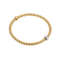 An 18ct yellow gold Flex'It bracelet with a single 18ct white gold diamond set rondel belonging to FOPE's EKA Collection.