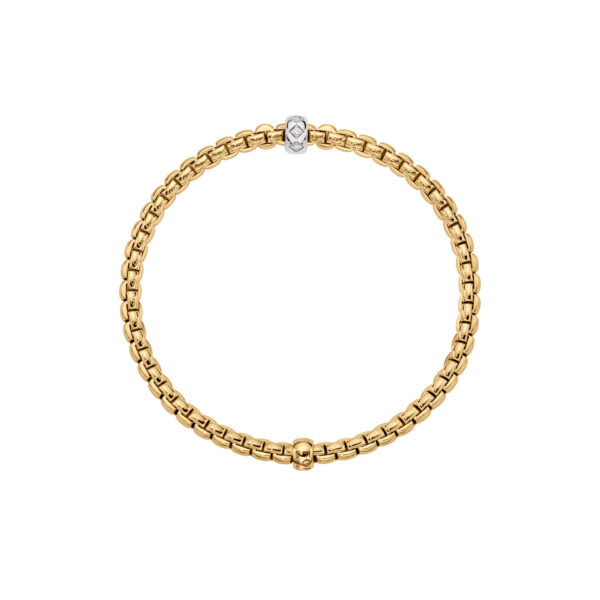 An 18ct yellow gold Flex'It bracelet with a single 18ct white gold diamond set rondel belonging to FOPE's EKA Collection.