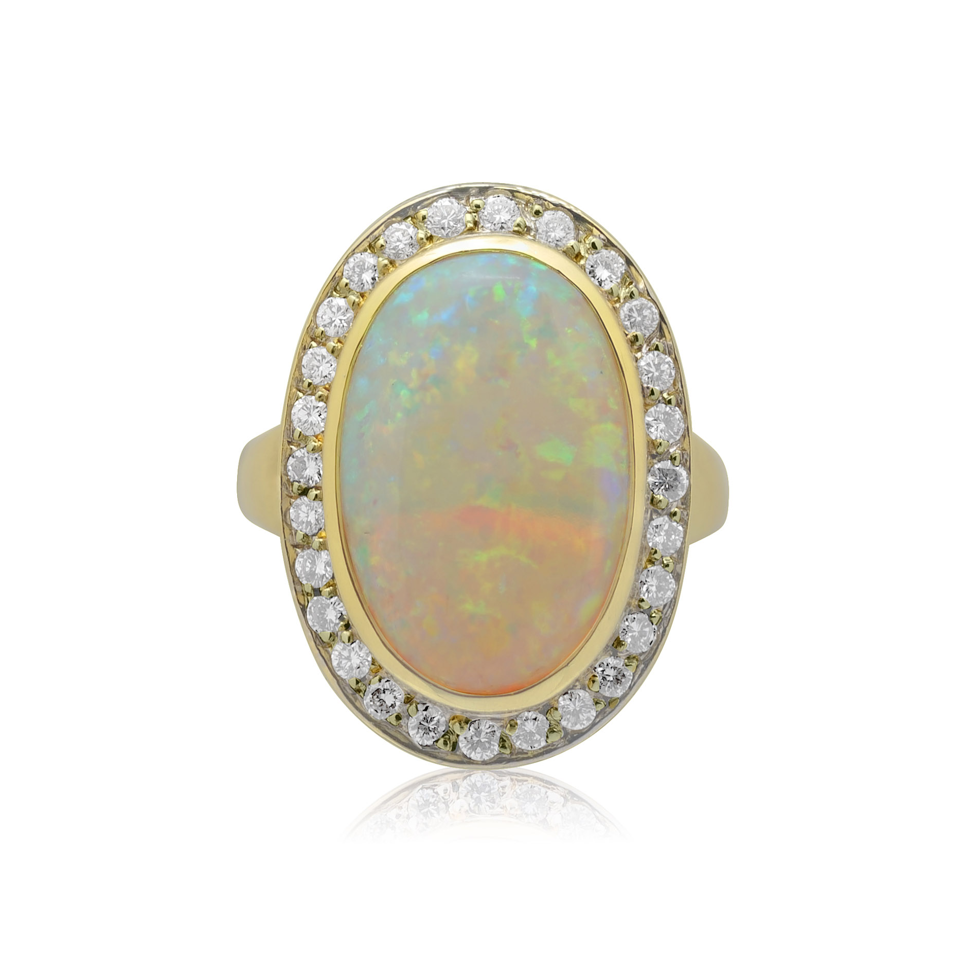 An 18ct yellow gold rubover set opal and round brilliant cut diamond cluster ring, with grain settings to the diamonds.
