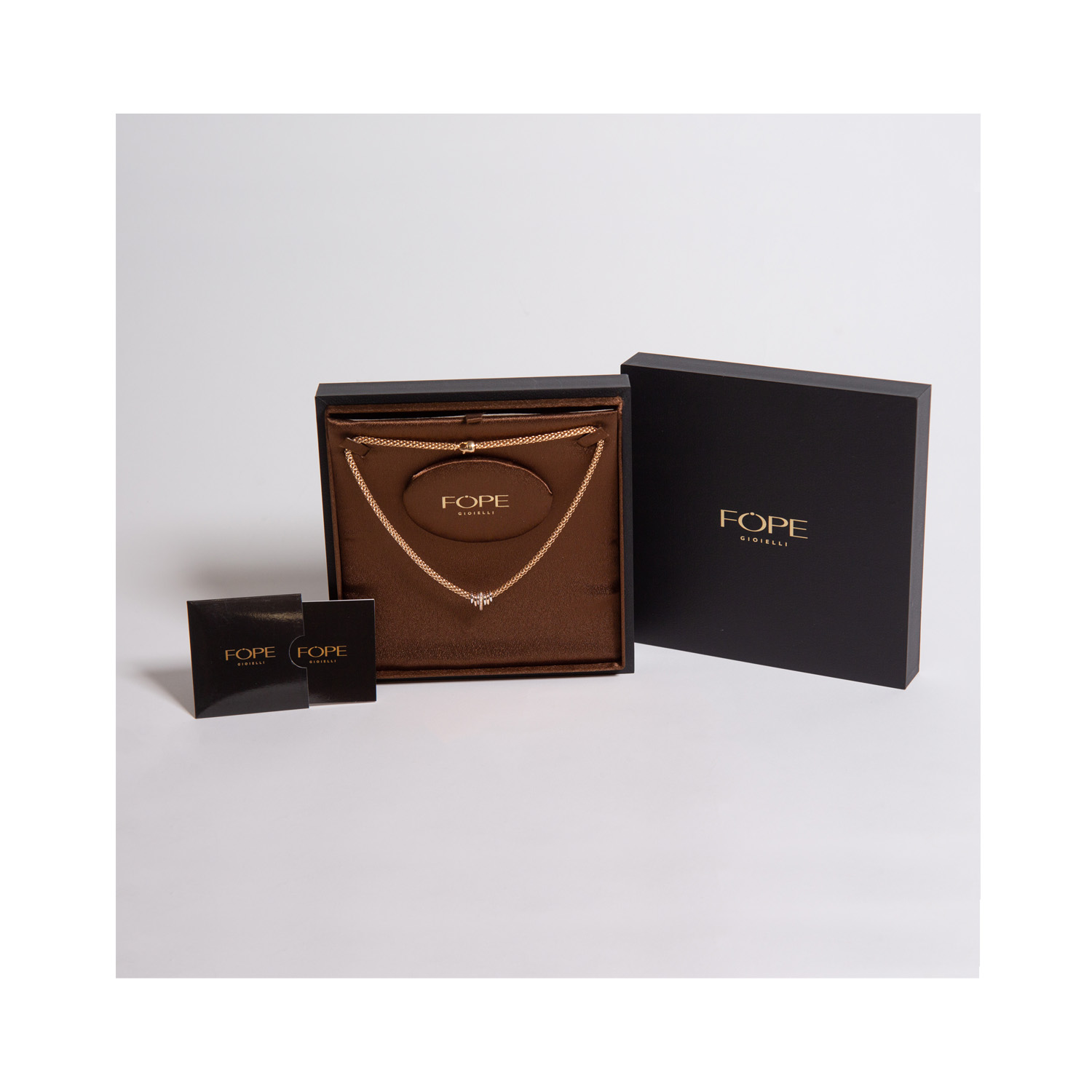 An 18ct rose and white gold necklace with one rose gold diamond set rondel, two rose gold polished rondels and four white gold polished rondels belonging to FOPE's Solo collection.