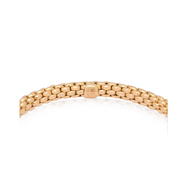 An 18ct rose gold Flex'It bracelet with one diamond set rose gold rondel, two polished rose gold rondels and four polished white gold rondels, belonging to FOPE's Solo collection.