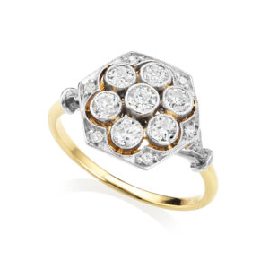 An Art Deco 18ct yellow gold and platinum hexagonal diamond cluster ring with old brilliant cut and rose cut diamonds. Possibly continental.