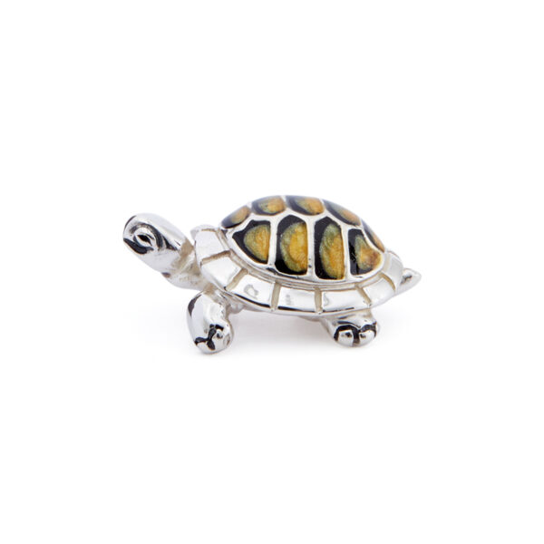 A sterling silver very small yellow tortoise figurine from Saturno by Francis Howard.