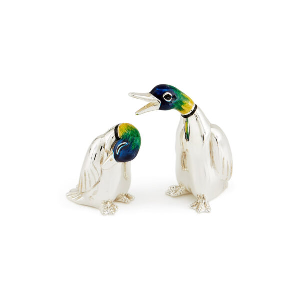 A sterling silver happy duck figurine from Saturno by Francis Howard.