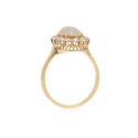 An antique oval shaped opal and old brilliant cut diamond cluster ring.