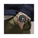 Hamilton, Khaki Navy Frogman with a 46mm stainless steel case and a green rubber strap featuring a black dial and bezel.