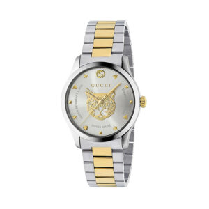 Gucci G-Timeless with a 38mm stainless steel and yellow gold PVD coated case and bracelet strap featuring a cat design on a silver dial.
