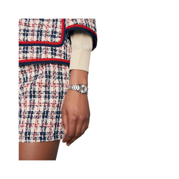 Gucci G-Timeless with a 27mm stainless steel case and bracelet strap featuring a cat design on a silver dial.