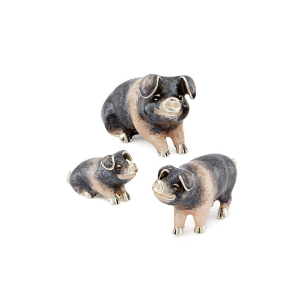 A sterling silver saddleback pig figurine from Saturno by Francis Howard.