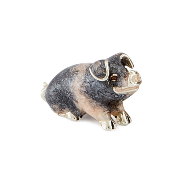 A sterling silver saddleback pig figurine from Saturno by Francis Howard.