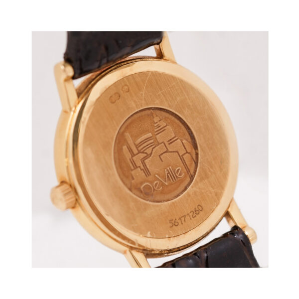 OMEGA, De Ville with a 24mm yellow gold case and a black leather strap featuring a silver coloured dial.