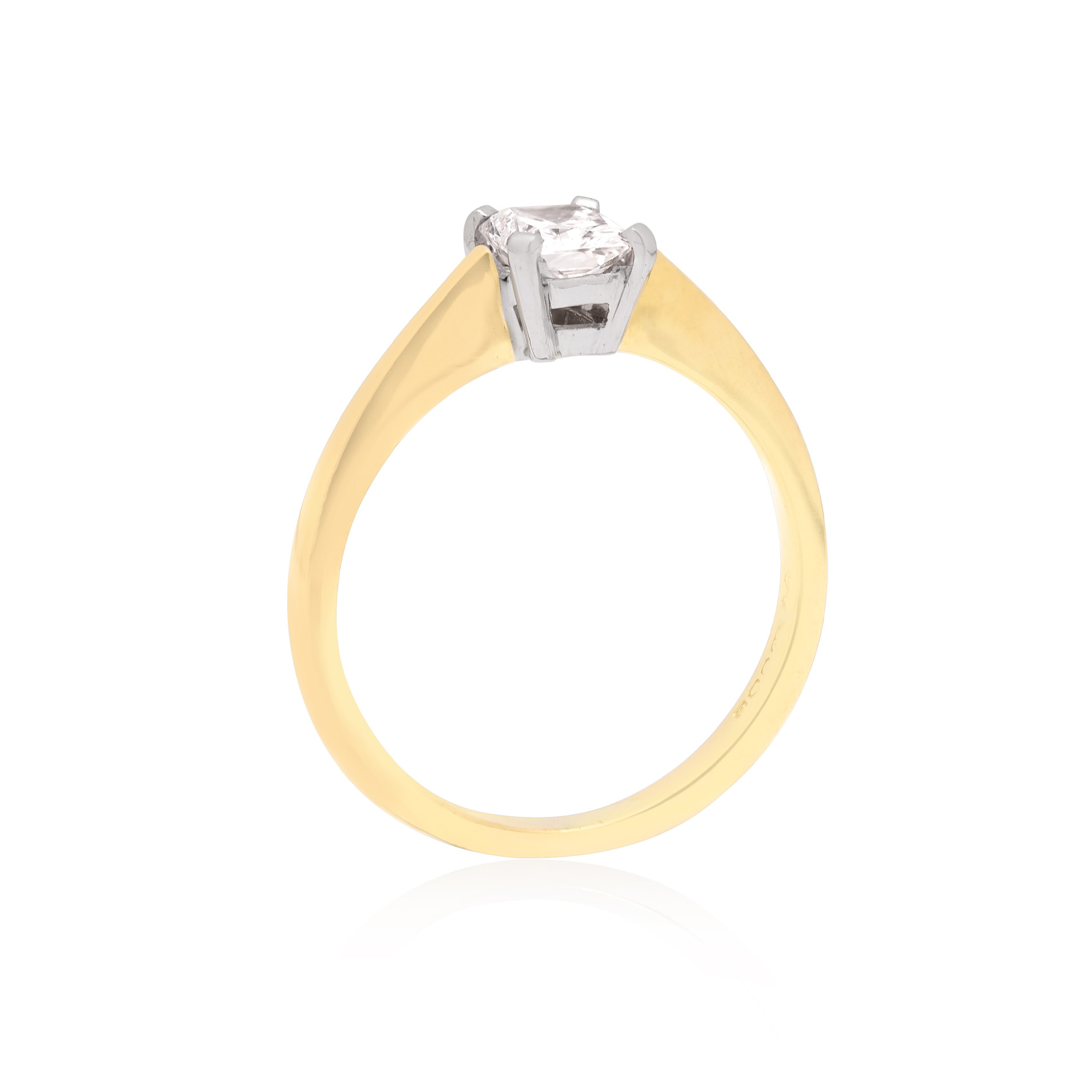 An 18ct yellow gold single stone radiant cut diamond ring, in a four claw setting.
