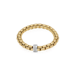 An 18ct yellow and white gold Flex'It bracelet with a single white gold diamond set rondel belonging to FOPE's EKA collection.