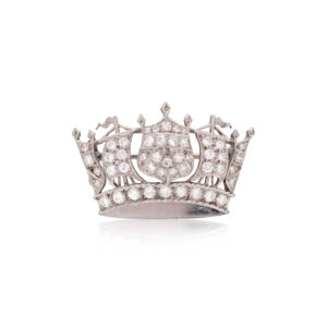 A vintage platinum diamond set crown brooch featuring round brilliant cut and eight cut diamonds.