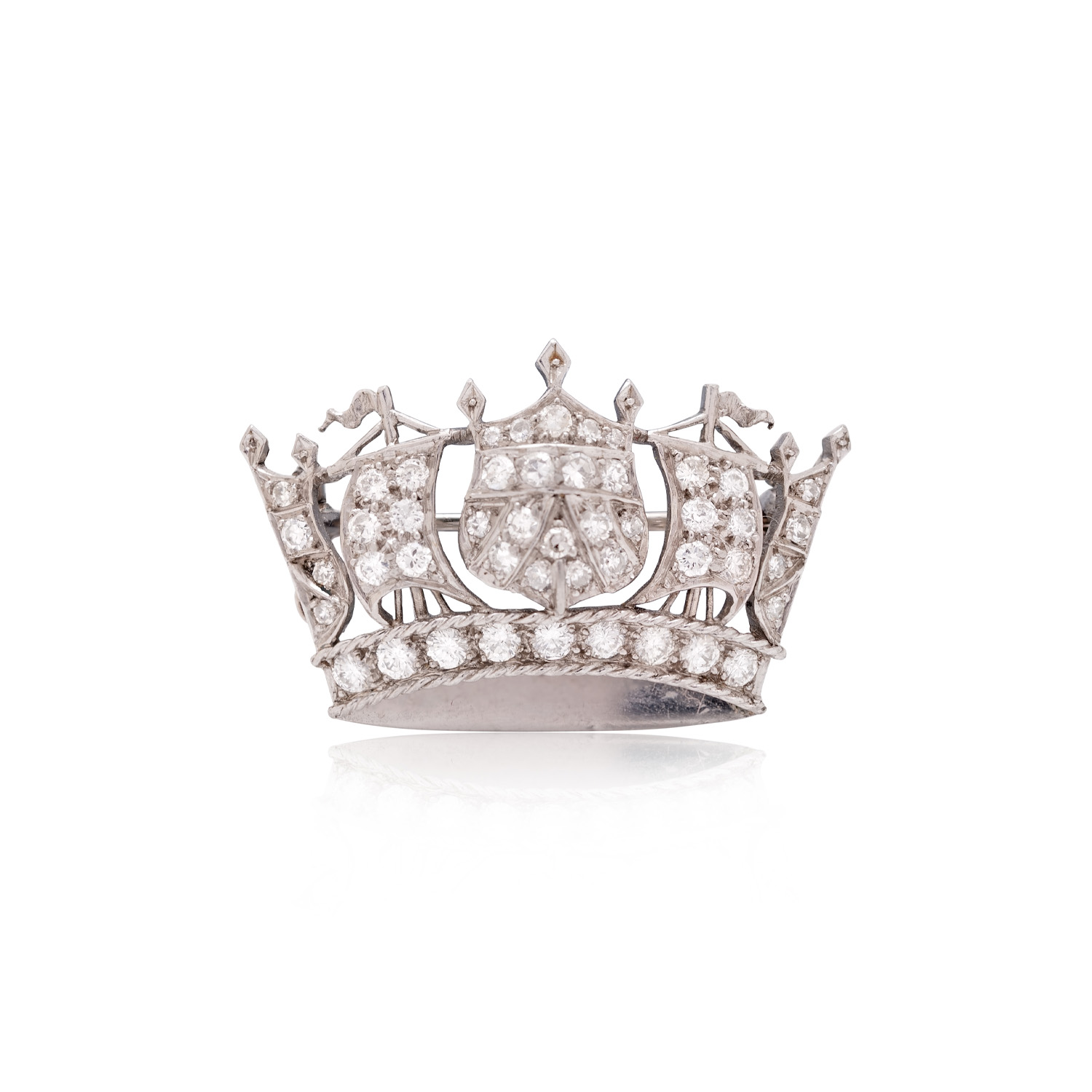 A vintage platinum diamond set crown brooch featuring round brilliant cut and eight cut diamonds.
