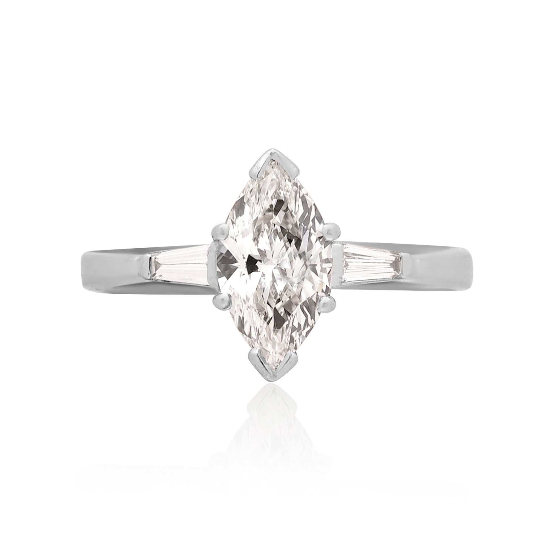 18ct White Gold Marquise & Brilliant Cut Diamond Ring with Baguette Cut Diamond Shoulders An 18ct white gold marquite and brilliant cut diamond solitaire ring with tapered baguette cut diamond shoulders.
